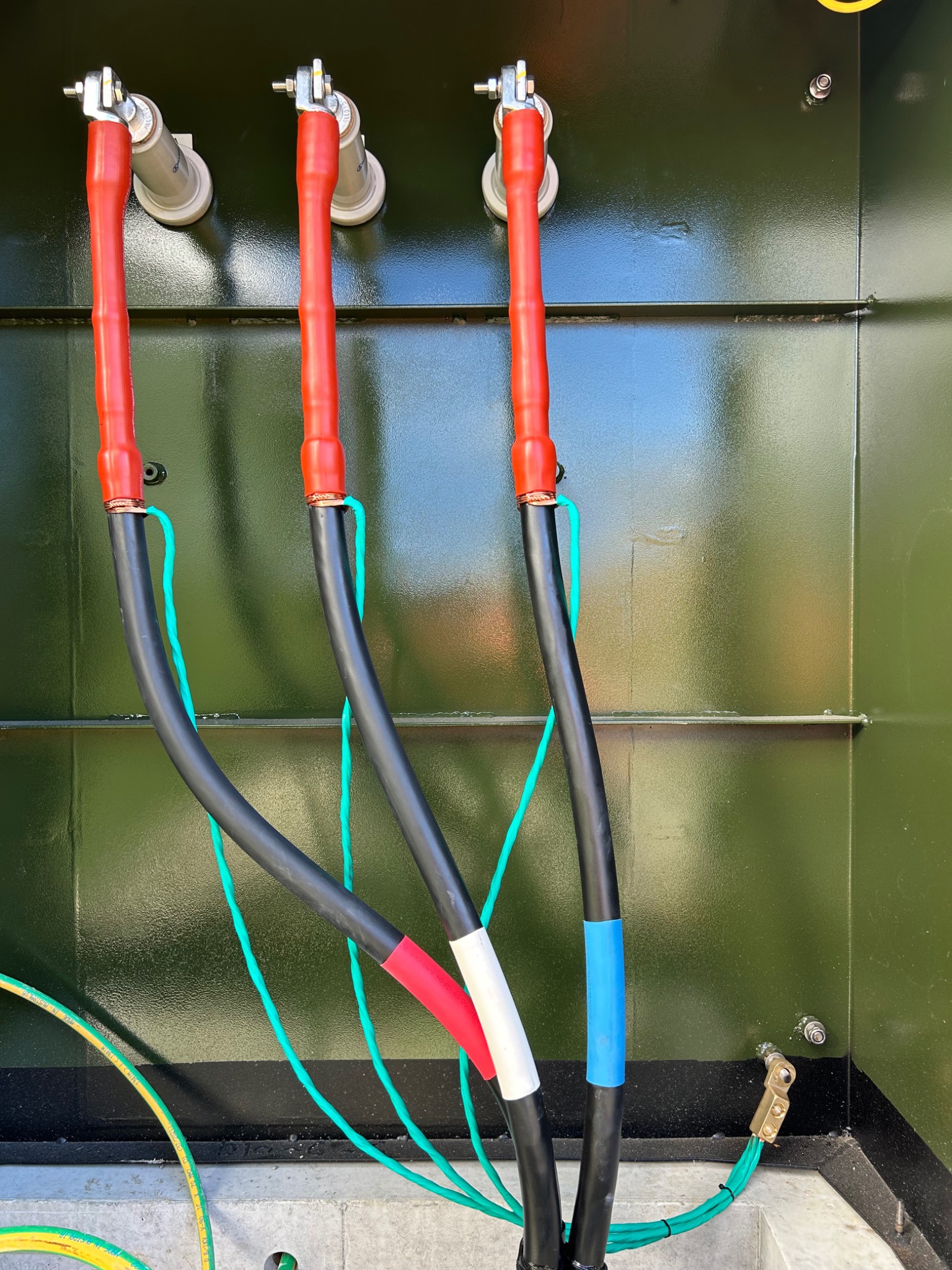 Three indoor cable terminations and shaped cables at a ground mounted transformer on Bowden Road, Auckland