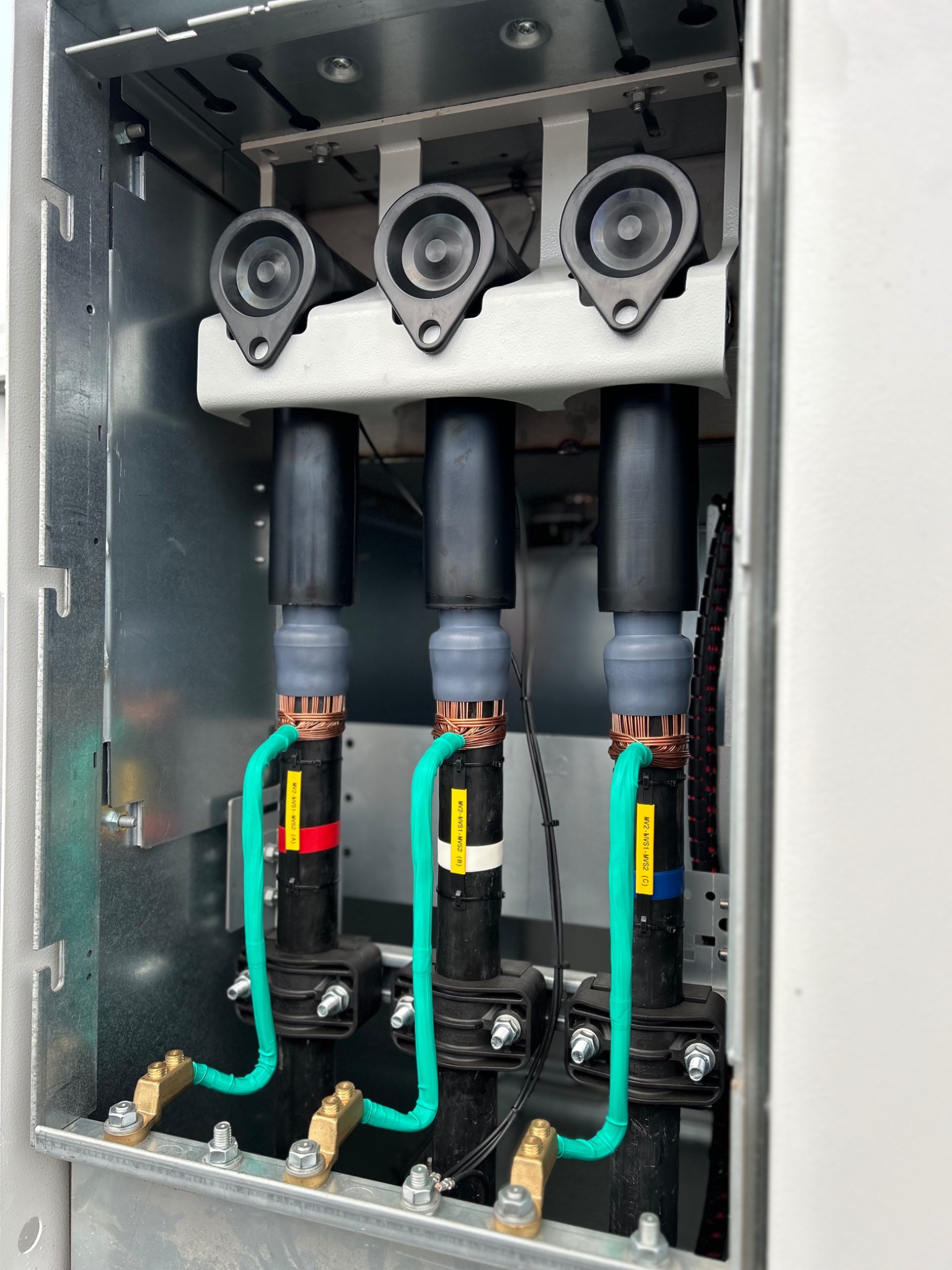 Three cable terminations installed in electrical equipment